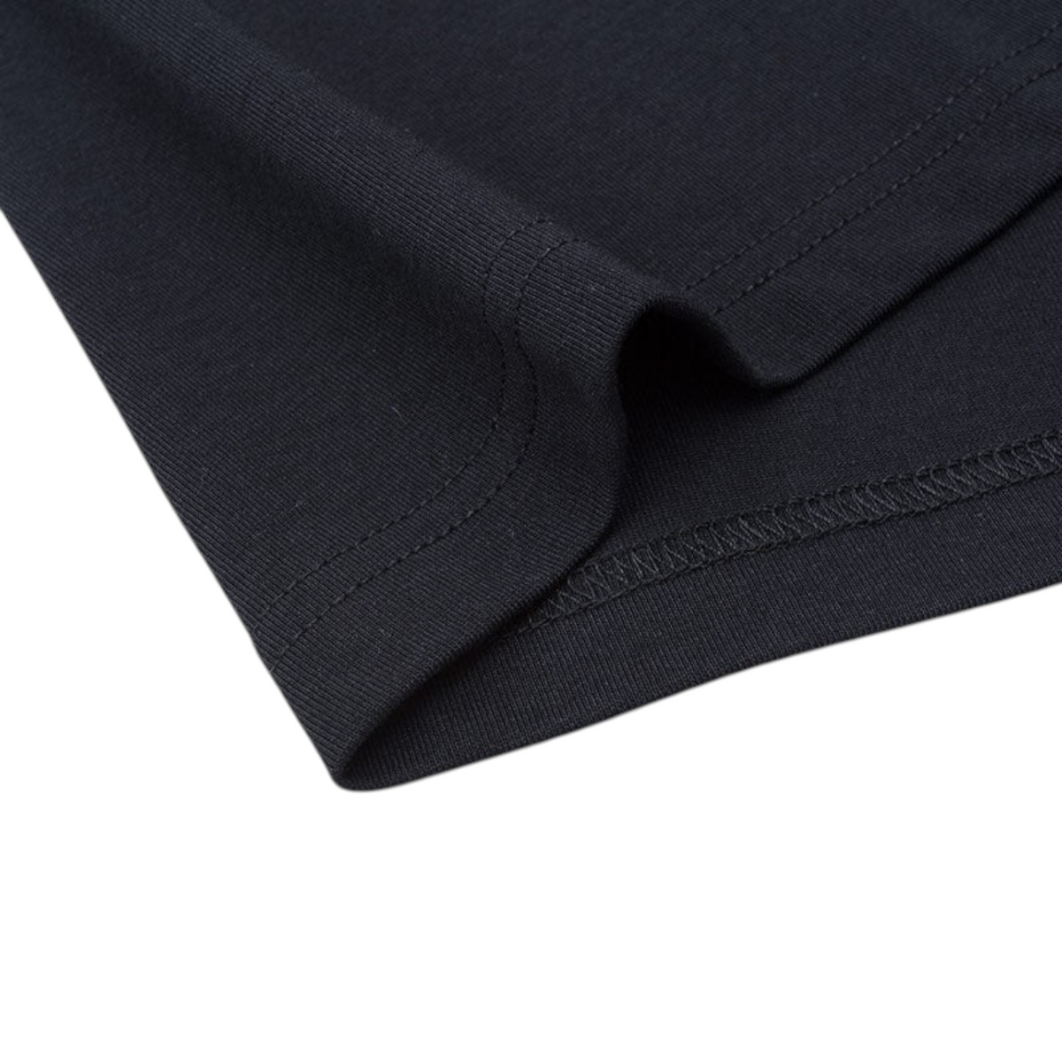 Close-up of the black cotton-blend fabric hem on an ANTA basketball t-shirt from FRG, showing durable stitching.