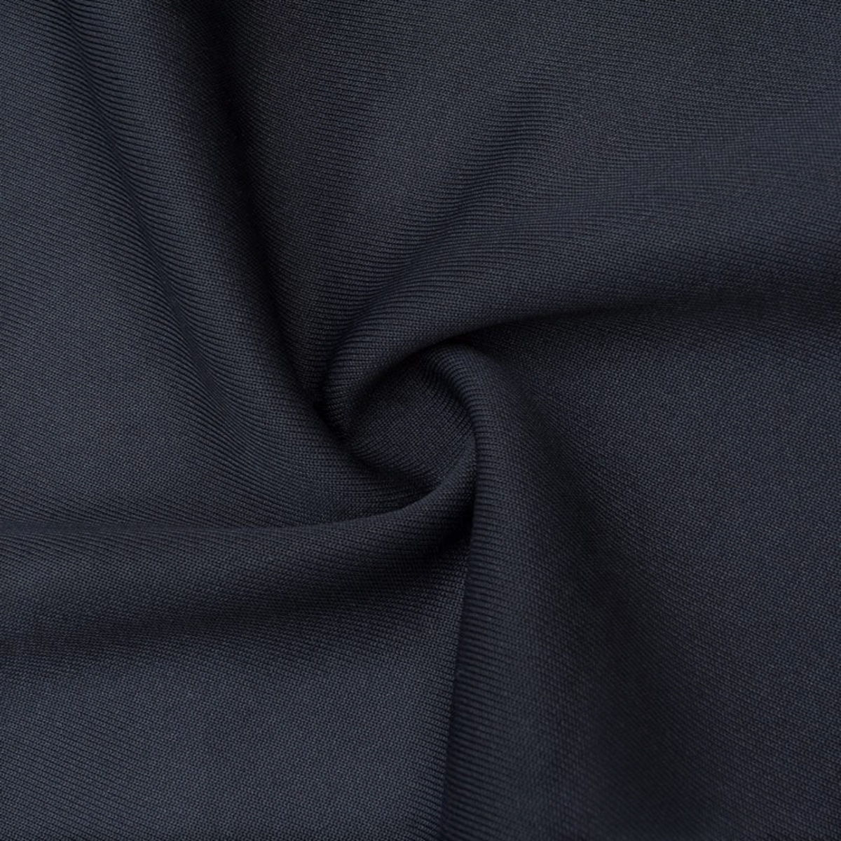 Close-up of black knit fabric from FRG ANTA track pants showing the soft, breathable polyester-cotton blend texture.