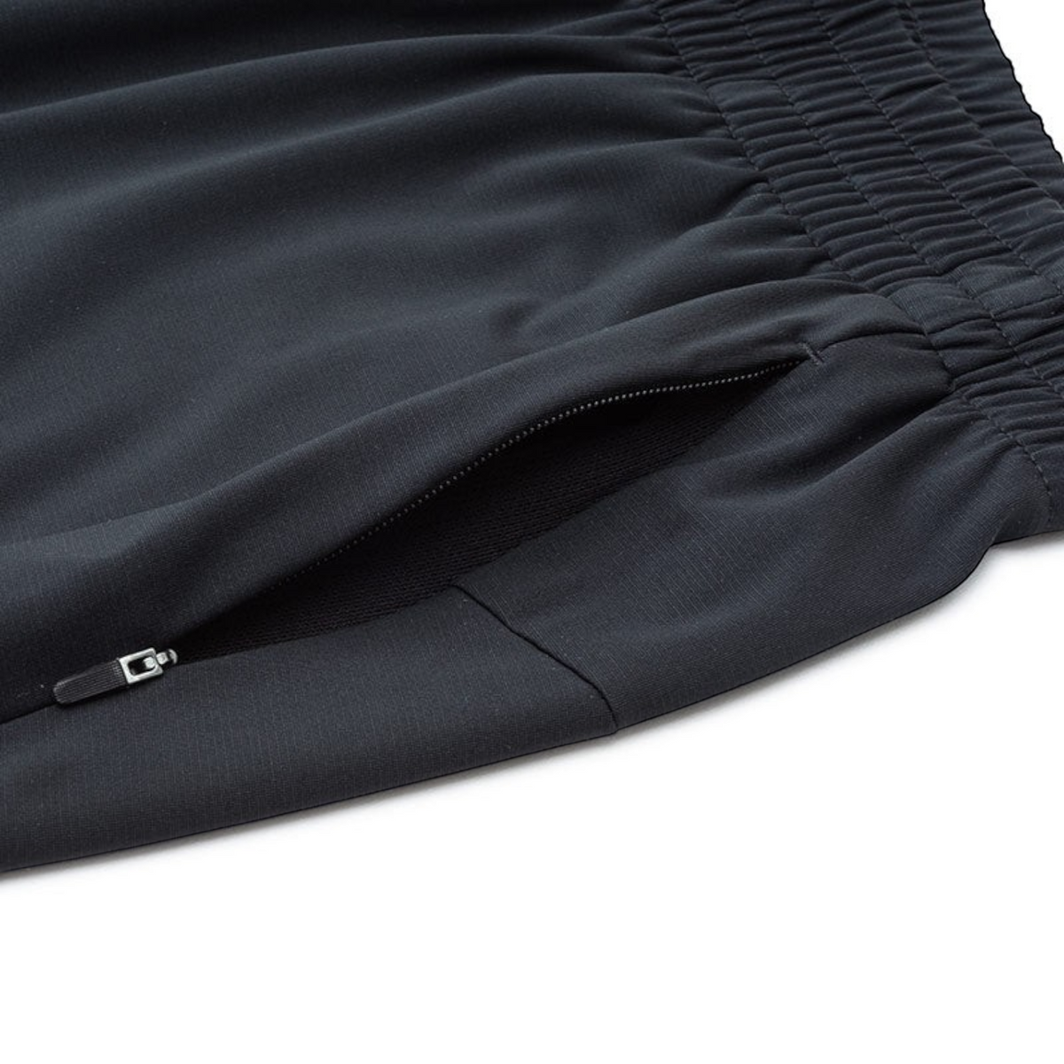 FRG ANTA A-Chill Touch II black running knit ankle pants featuring a secure zippered side pocket and elastic waistband