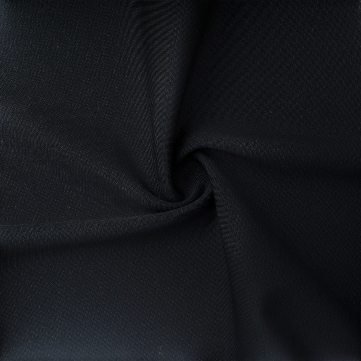 FRG ANTA A-Chill Touch II black running knit fabric texture showing smooth, stretchy material detail.