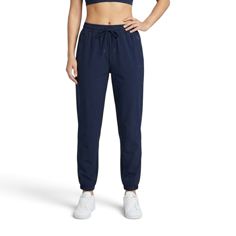 FRG ANTA navy athletic knit track pants with cuffed ankles and drawstring waist worn by a woman