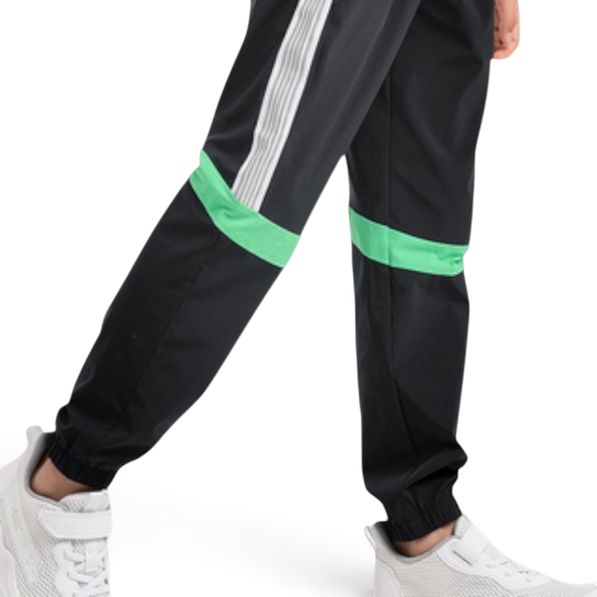 FRG ANTA black woven track pants with green accents and white side stripes worn with white sneakers