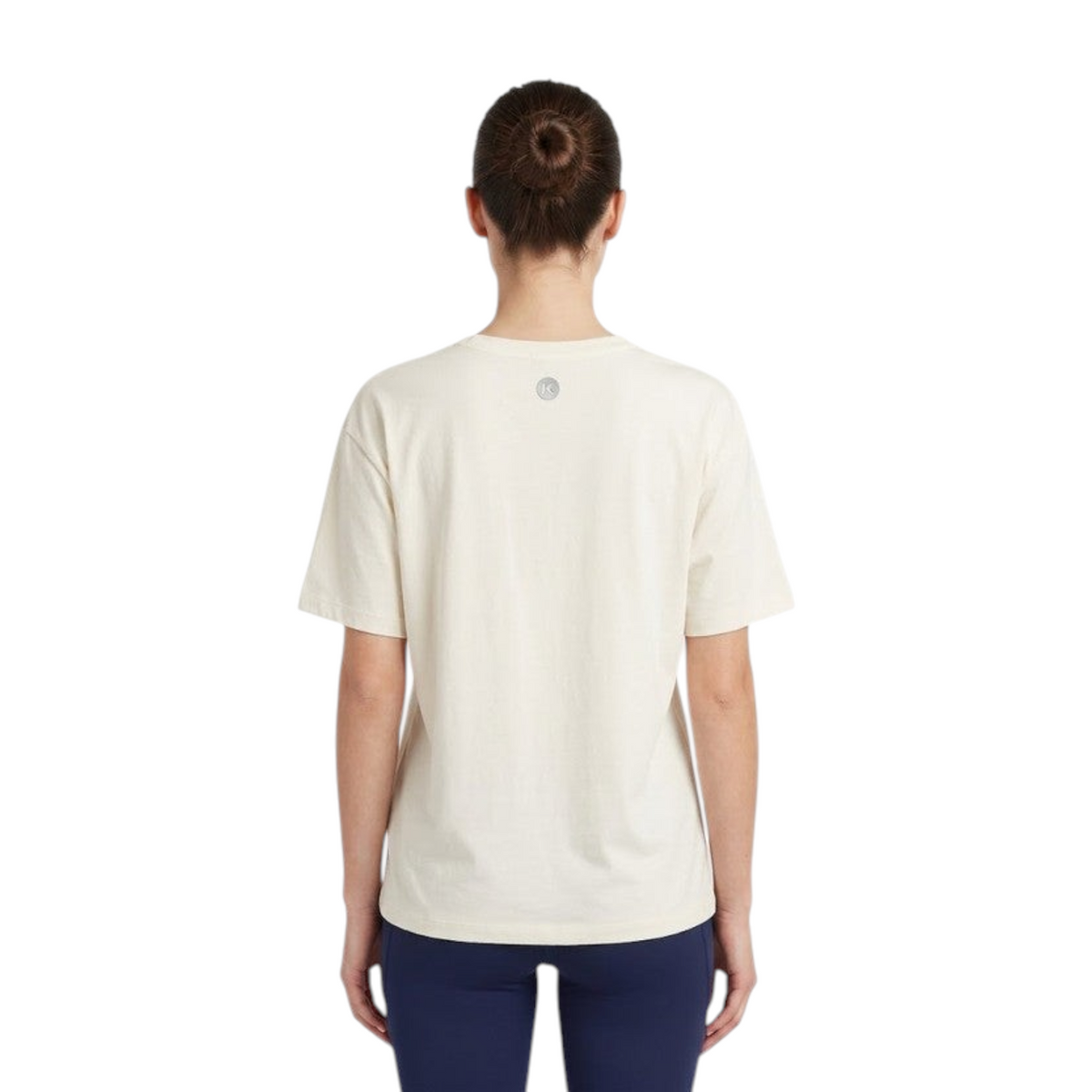 Back view of a person wearing an FRG off-white oversized athletic t-shirt with a small circular logo on the neck