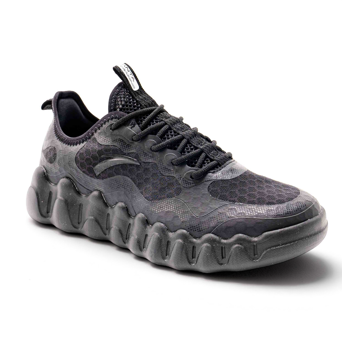 FRG black lifestyle outdoor shoes with a textured mesh upper and a chunky, wave-patterned rubber sole.