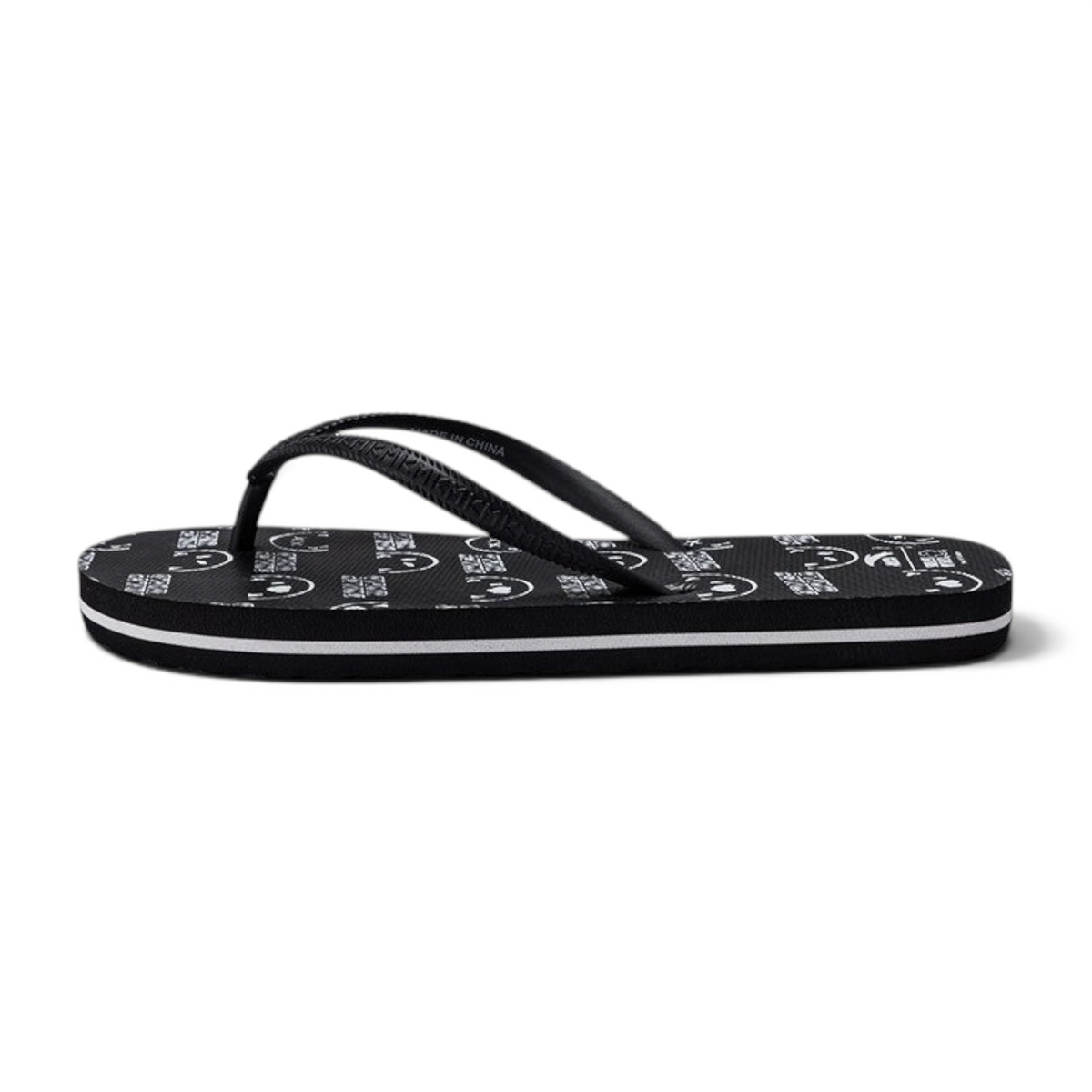 FRG beach slippers in black with a white graphic print pattern and a side-striped sole