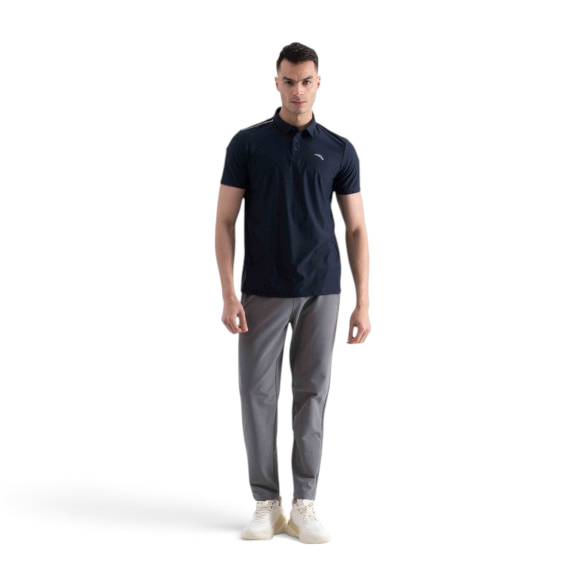 FRG SS POLO navy short sleeve shirt worn by a male model with grey trousers and white sneakers