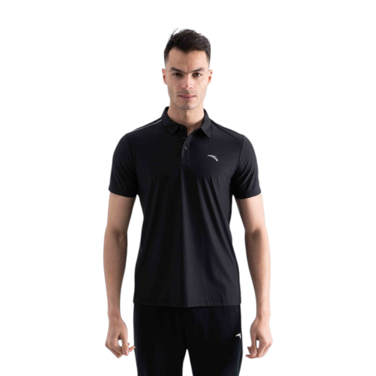 A man wearing a black FRG short-sleeve polo shirt with a subtle textured fabric and a small reflective logo on chest.