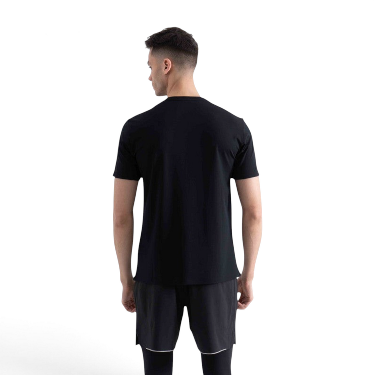Back view of a man wearing a plain black FRG short sleeve t-shirt with a crew neck against a white background