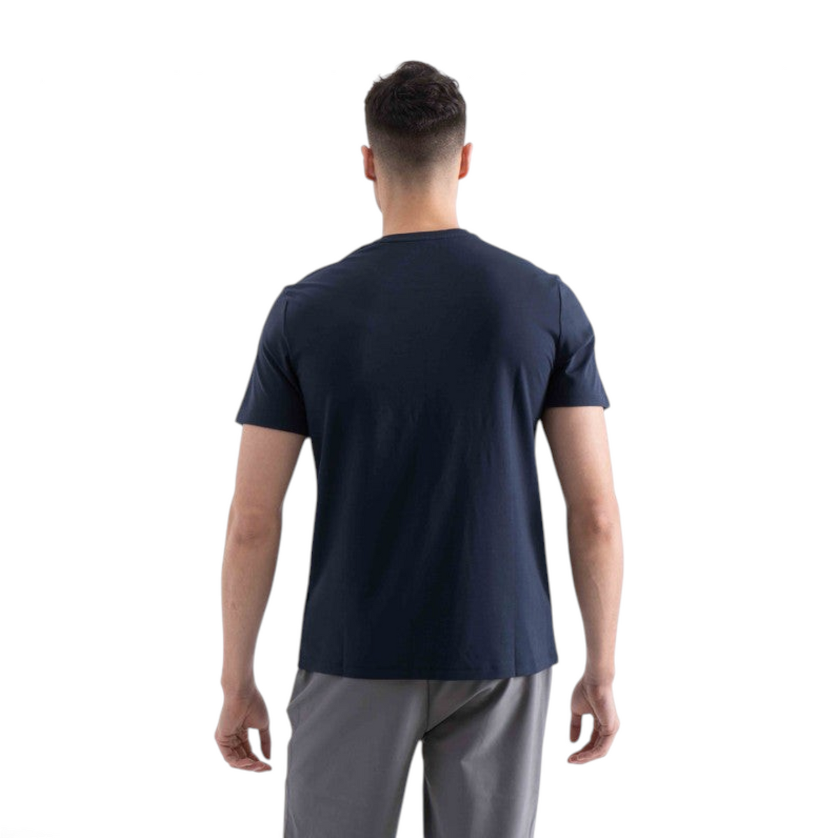 Back view of a man wearing a navy blue FRG short sleeve t-shirt against a plain white background.