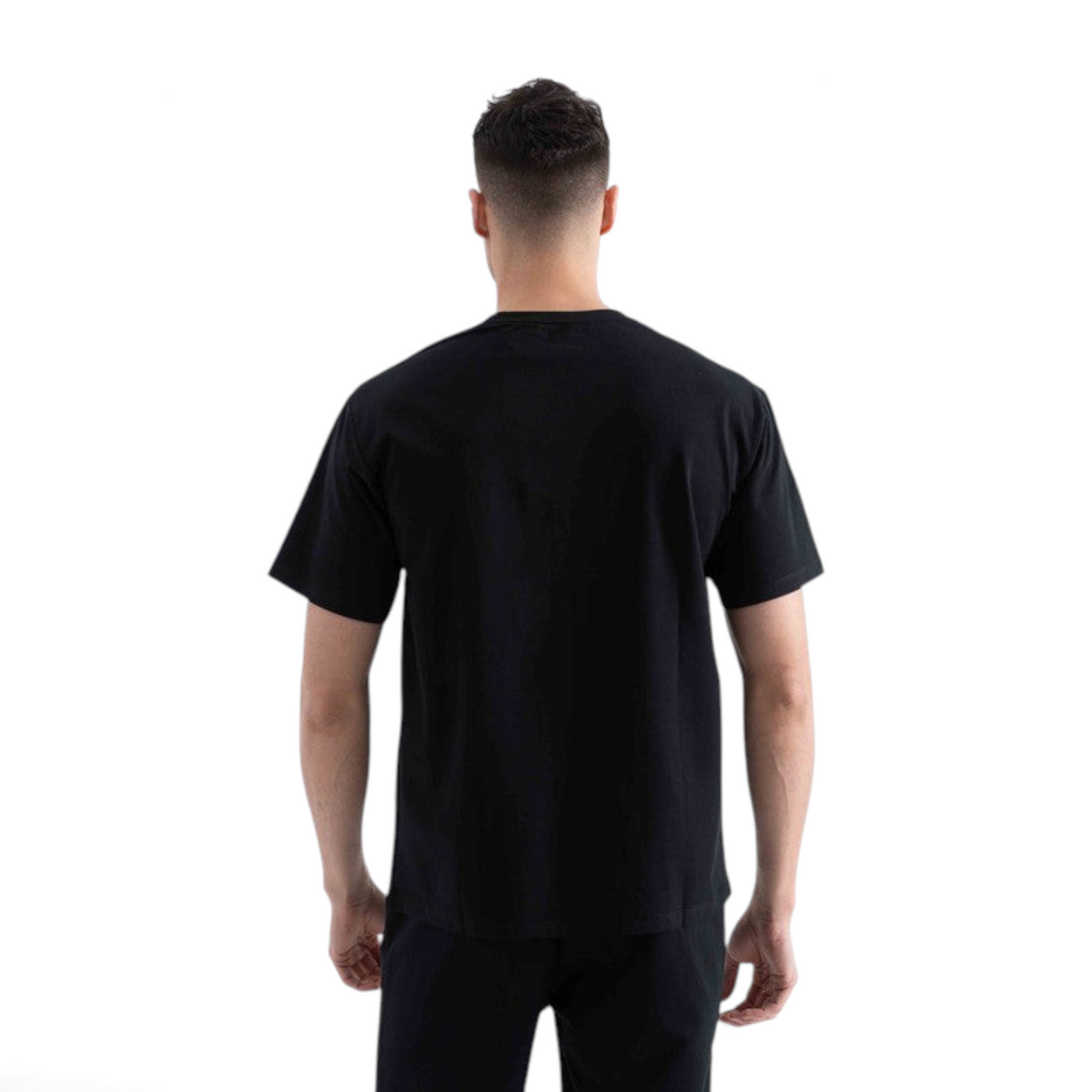 Back view of a man wearing a plain black short-sleeve crew neck t-shirt from FRG