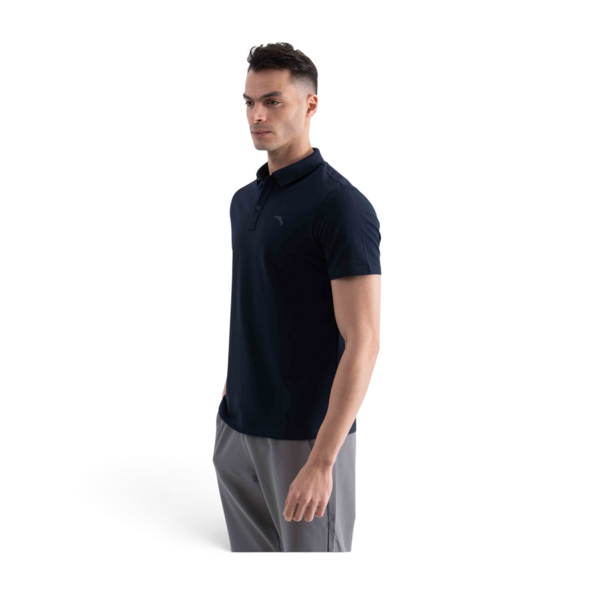 A man wearing a navy blue FRG short-sleeve polo shirt with a classic collar and button placket.