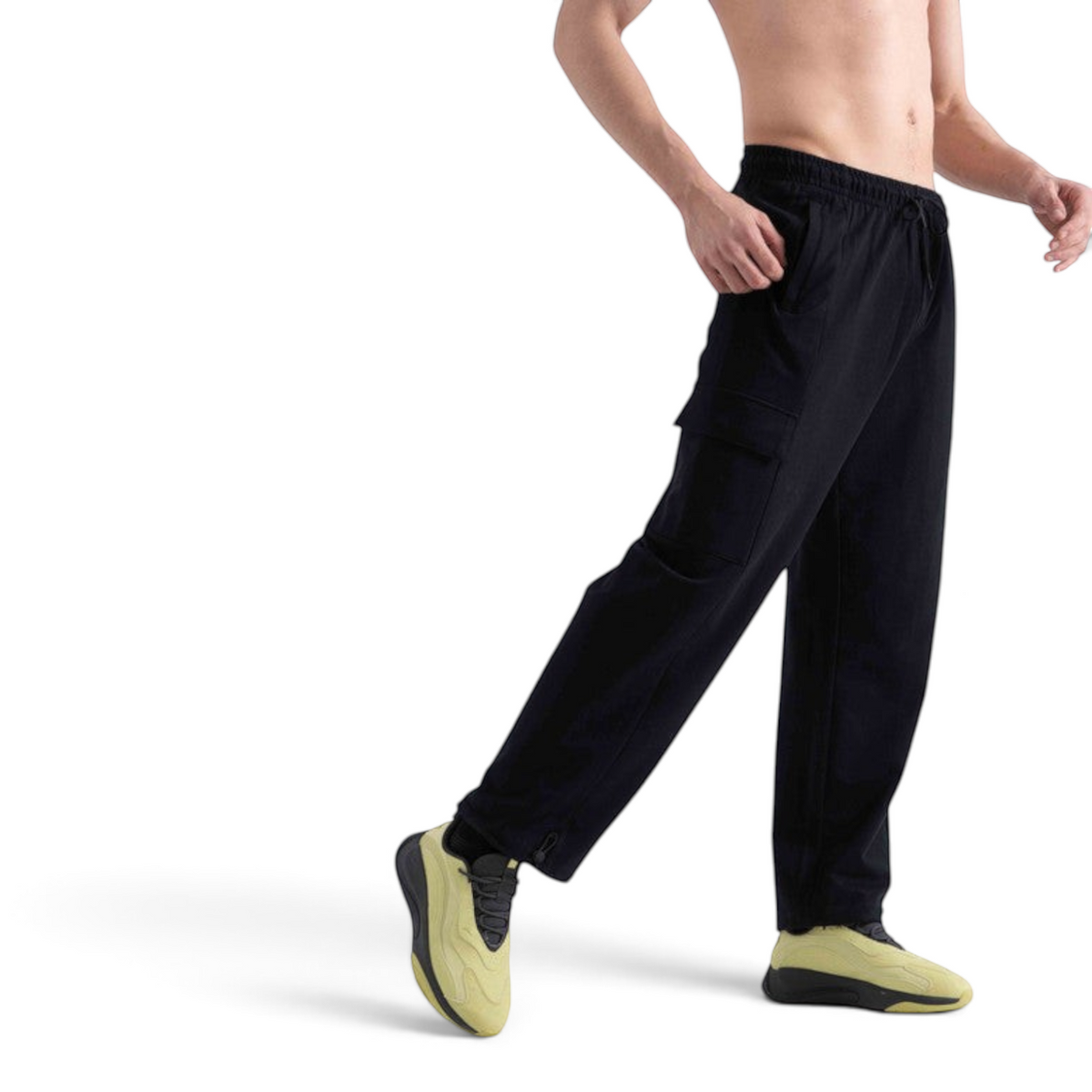 FRG black knit track pants with cargo pockets and elastic drawstring waist worn by a man on a white background
