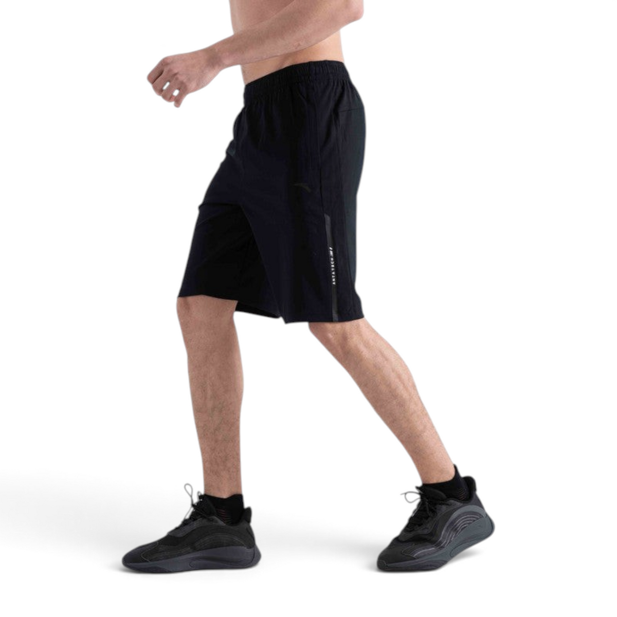FRG men's black knit half pants for cross training with a side stripe detail, shown from a side profile view.