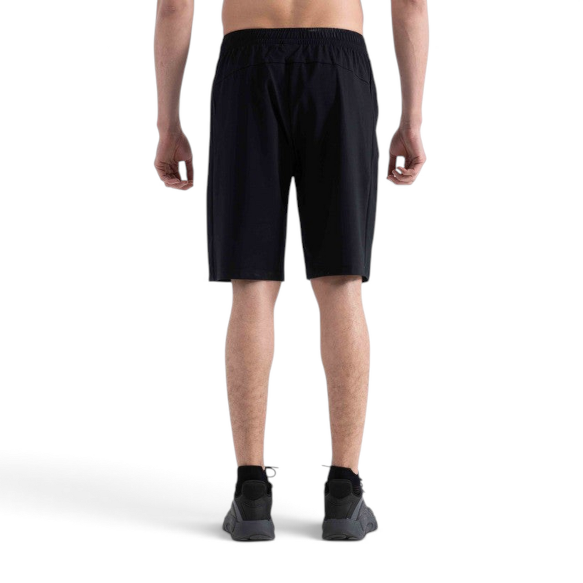 Back view of FRG black knit half pants for men, designed for cross training with an elastic waistband.