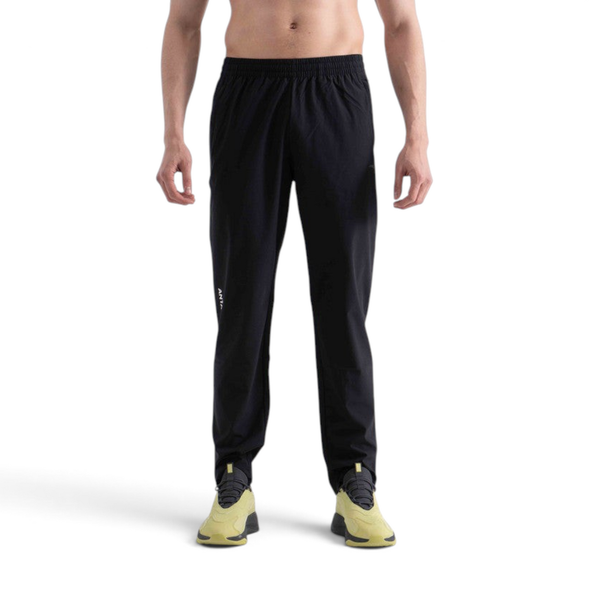 FRG men's black woven track pants for cross training, featuring a comfortable elastic waistband and athletic fit.