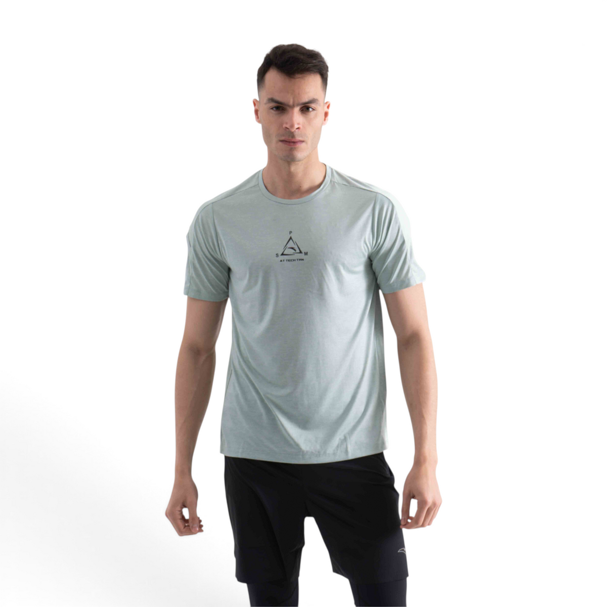 FRG light green short sleeve athletic t-shirt with a small geometric chest logo worn by a man