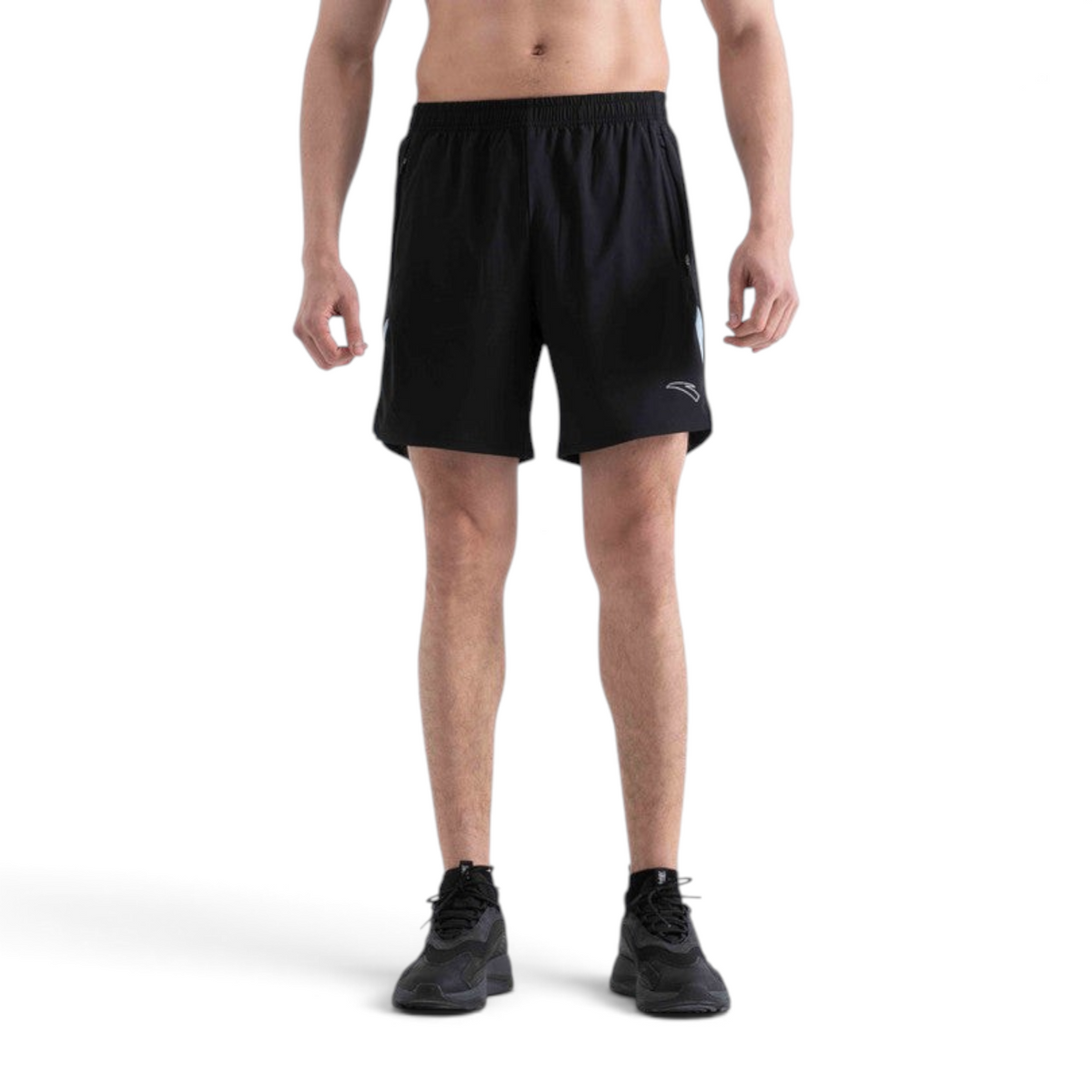 FRG black athletic woven shorts with an elastic waistband and small logo detail worn by a man