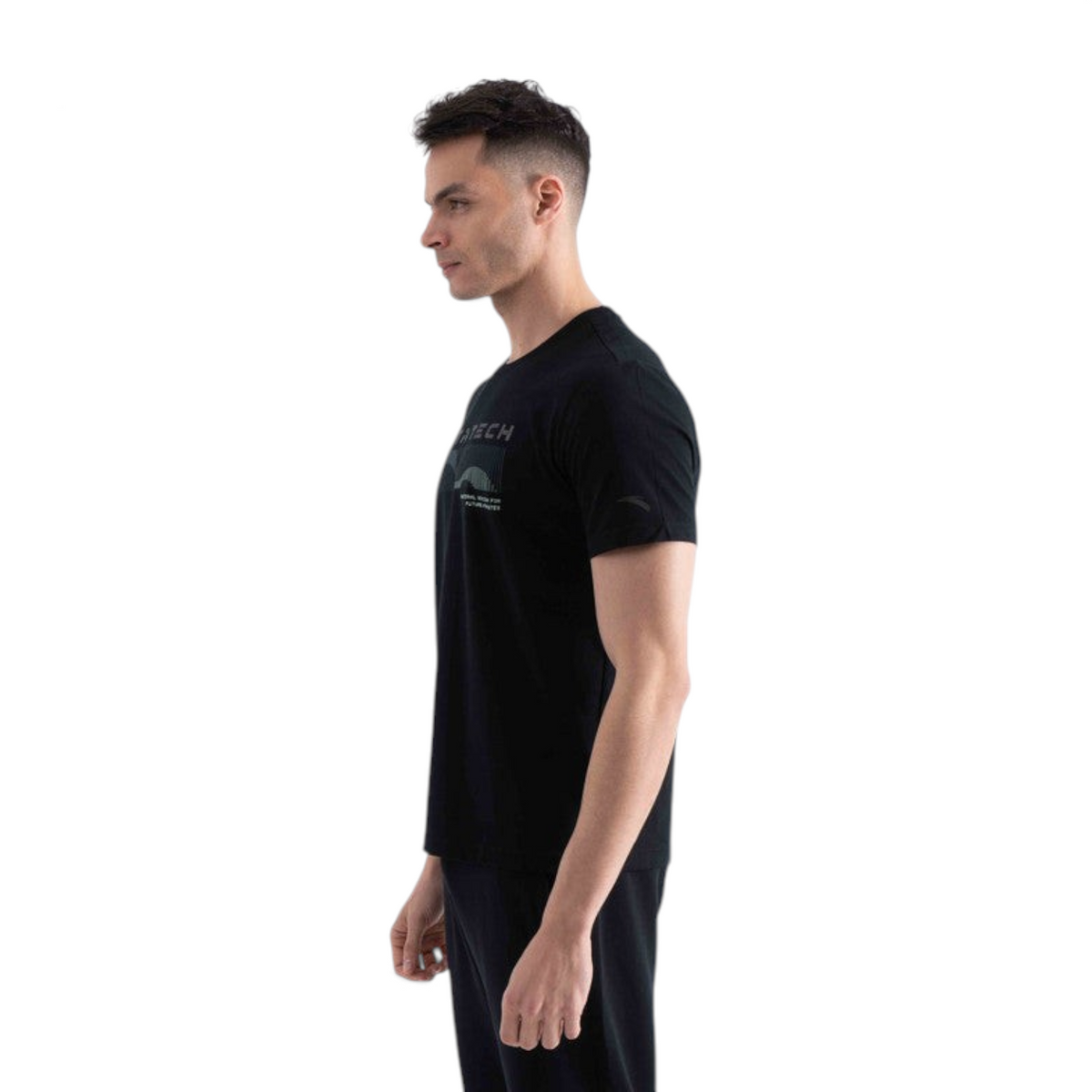 FRG black short sleeve t-shirt with graphic print on chest worn by a man in profile view