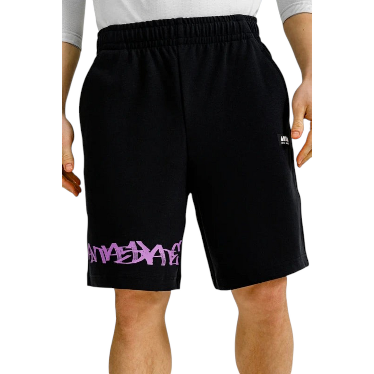 FRG ANTA black knit half pants featuring a purple graphic print on the leg and a comfortable elastic waistband.