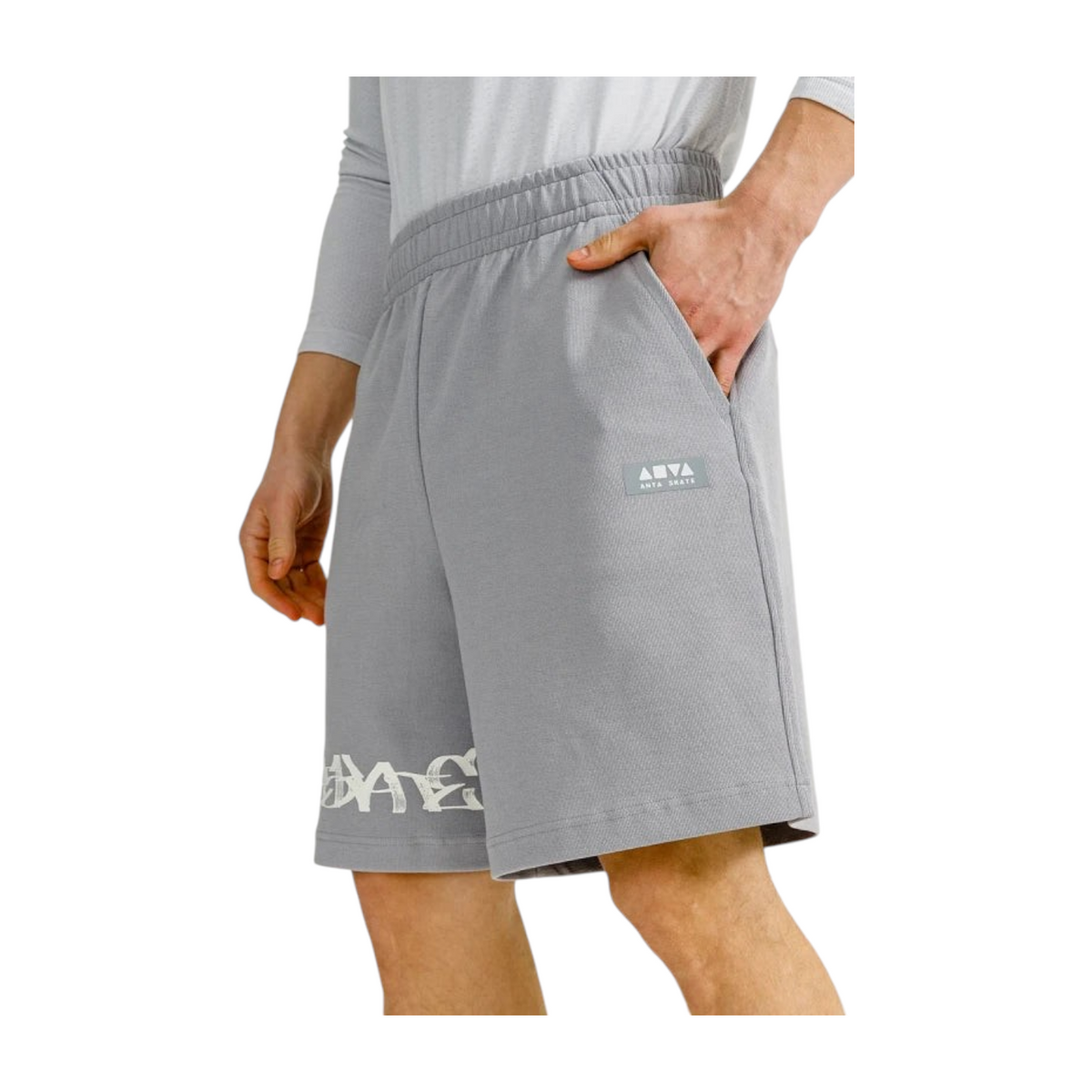 FRG ANTA grey knit half pants featuring a comfortable elastic waistband, side pockets, and graphic logo detailing.