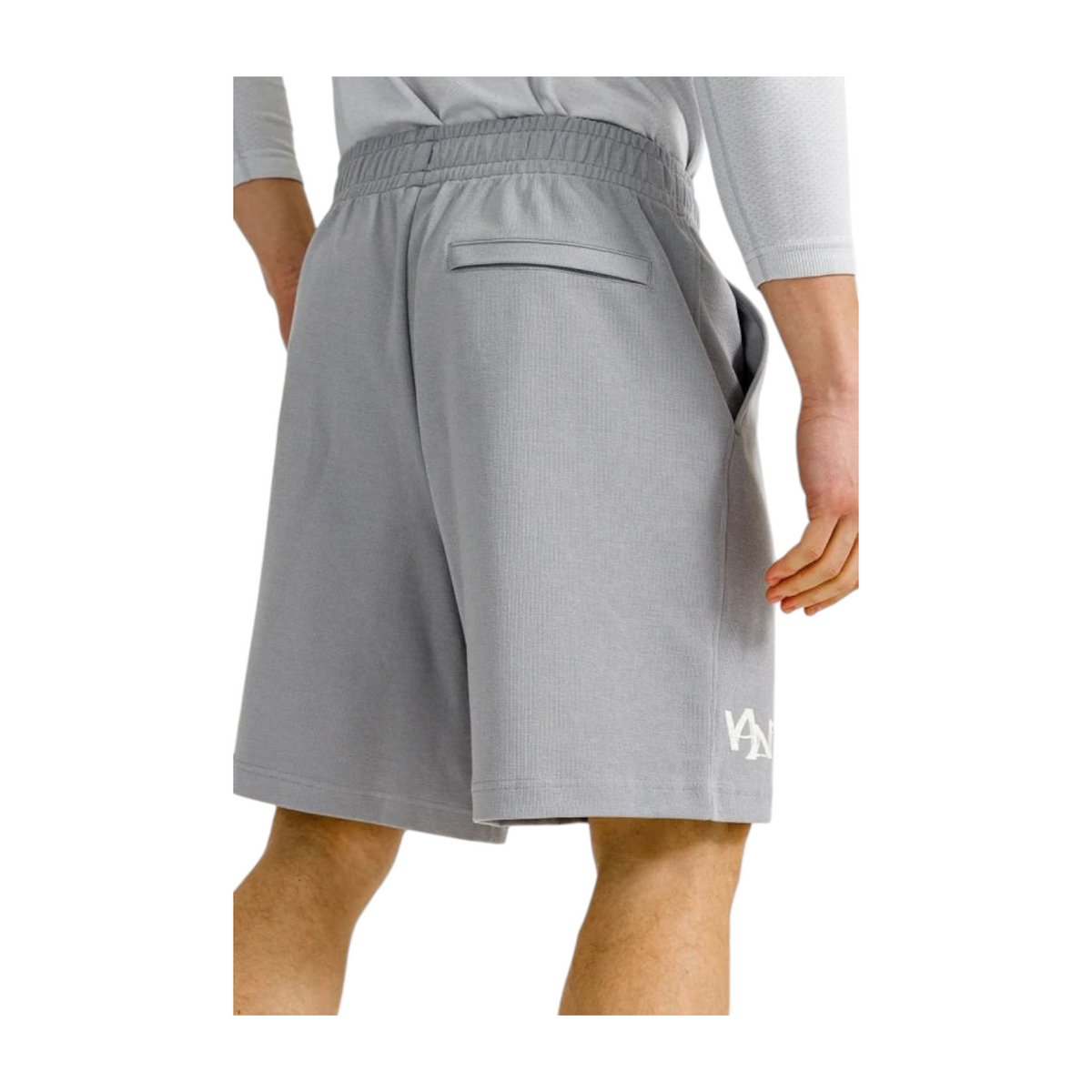 FRG ANTA grey knit half pants featuring a back pocket and white logo detail on a model
