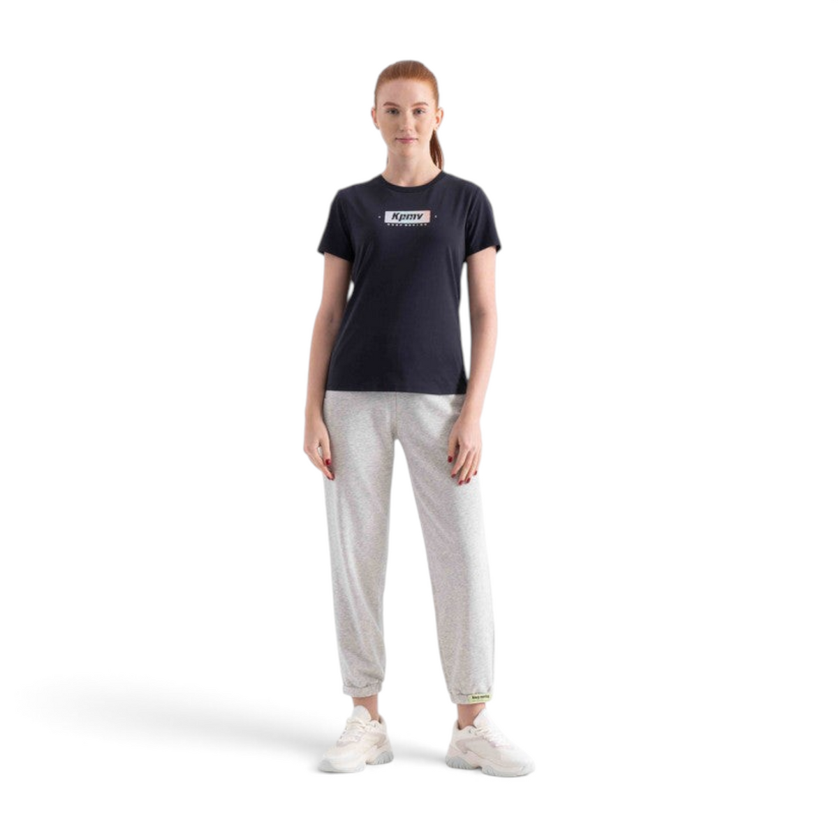 FRG regular fit black cotton blend t-shirt with graphic logo print worn by a woman with grey joggers and sneakers