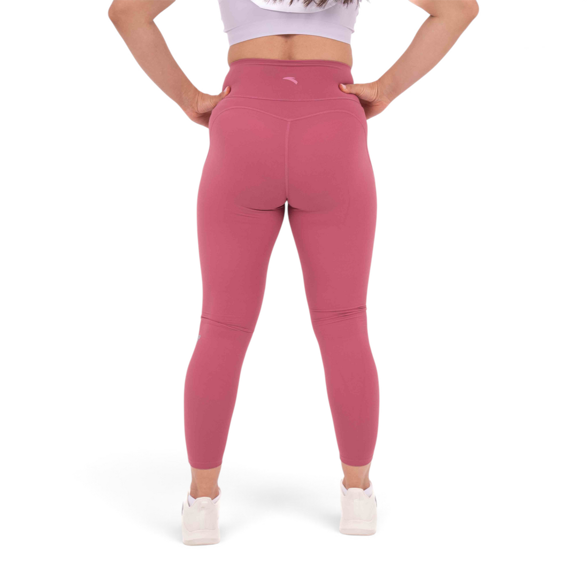 FRG slim fit tight ankle pants in dusty rose polyamide spandex blend worn by a woman from the back view
