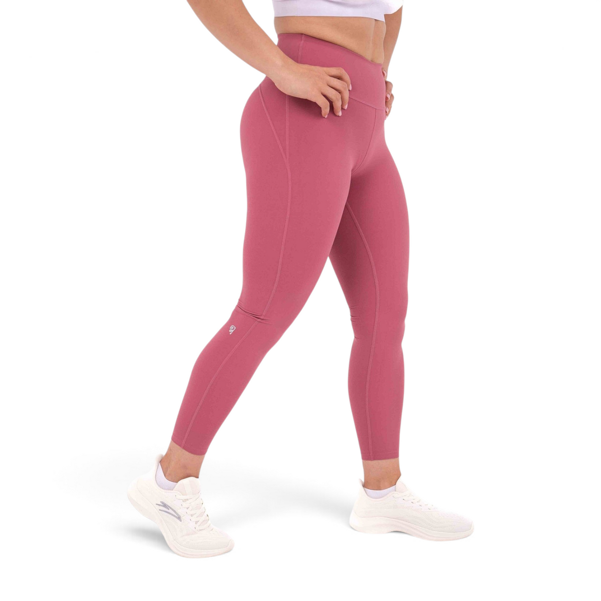 FRG slim fit tight ankle pants in dusty rose polyamide spandex blend worn by a model with white sneakers