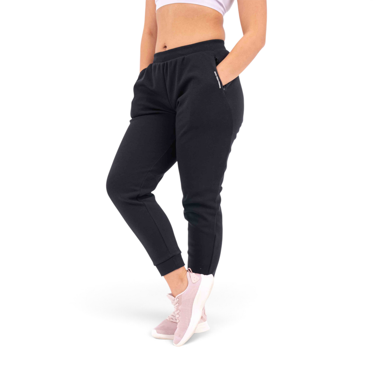FRG black knit track pants with a regular fit, featuring side pockets and cuffed ankles on a model