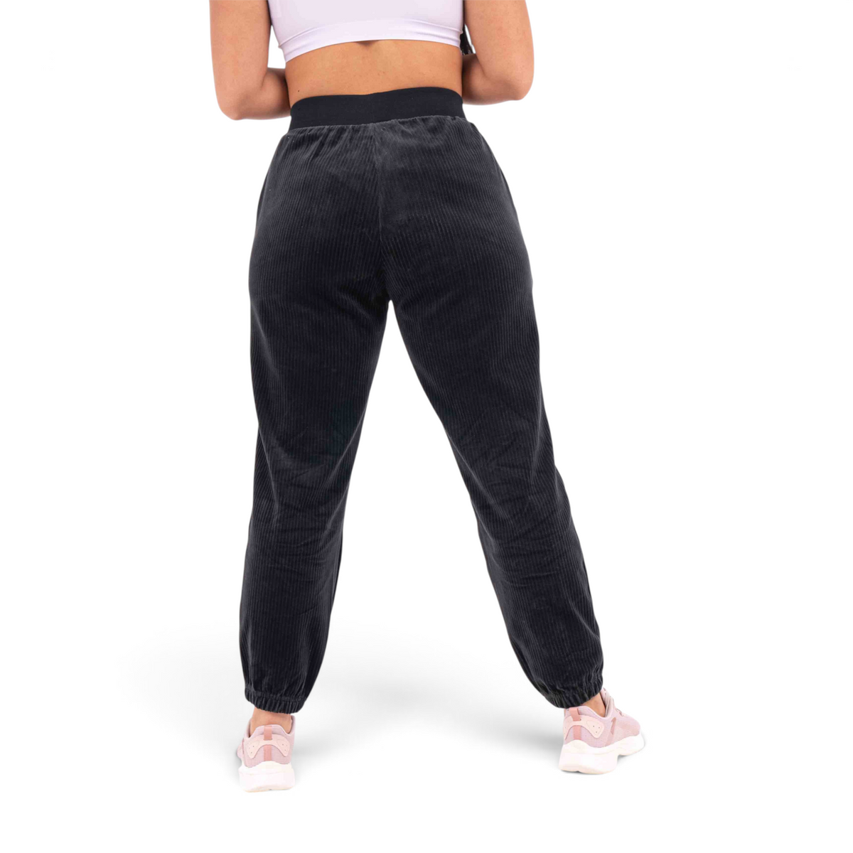 FRG black corduroy knit track pants with a regular fit and elasticated cuffs worn by a woman from the back view