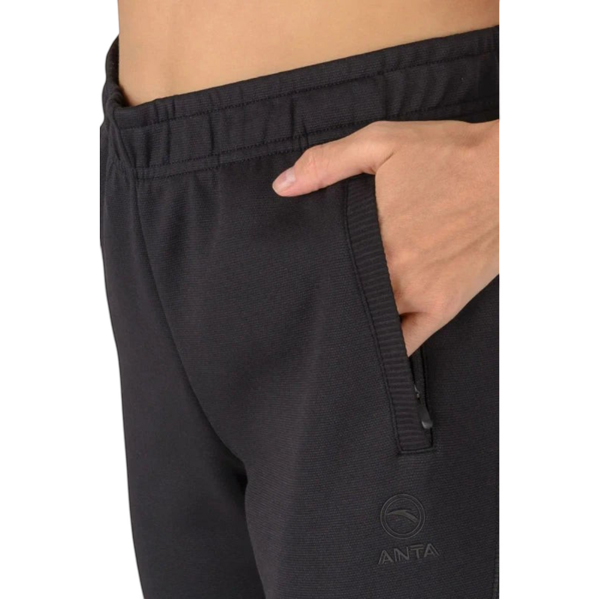 FRG ANTA A-Sports black knit track pants with a zippered side pocket and subtle logo detail on the hip