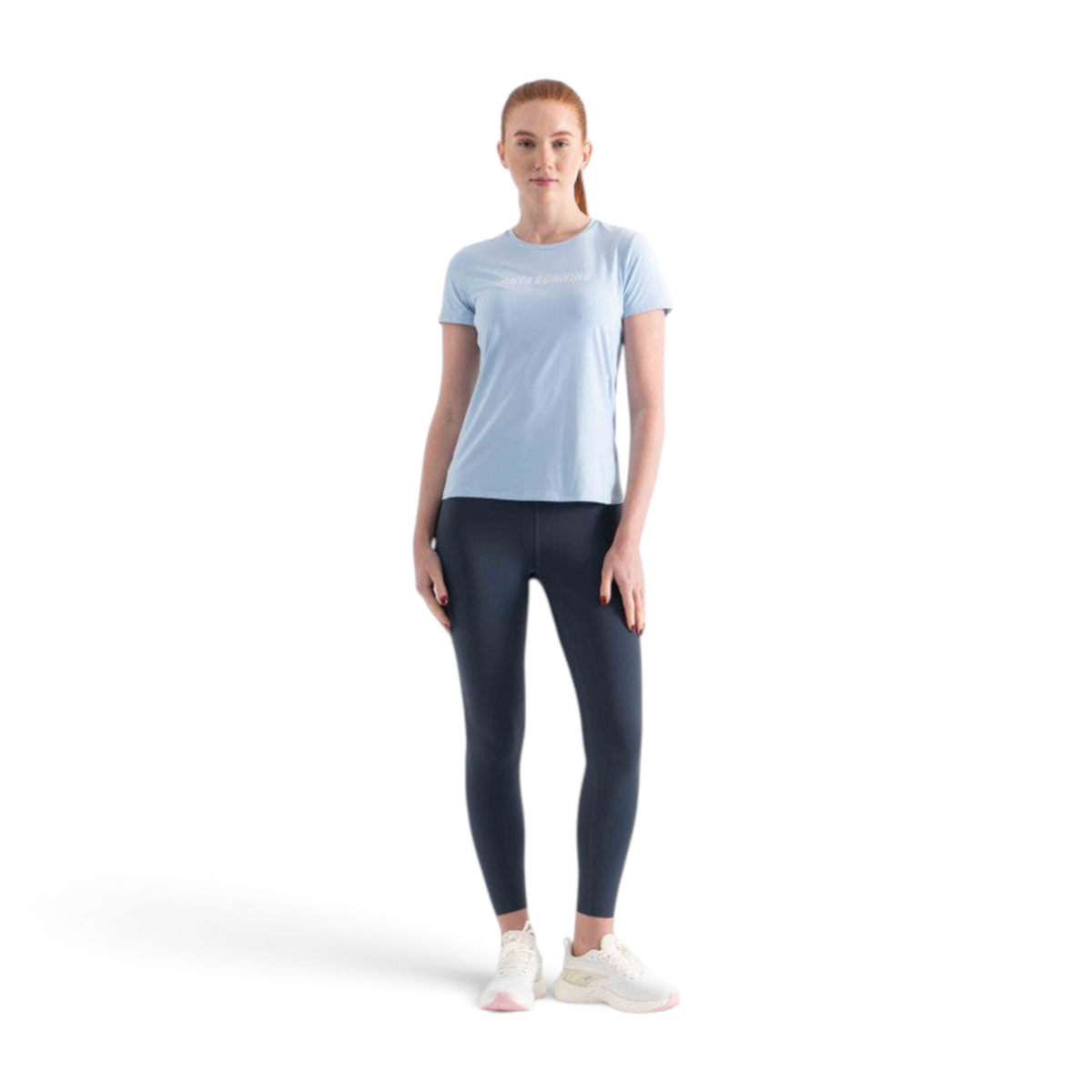 FRG light blue short sleeve running t-shirt worn by a woman with dark leggings and white sneakers