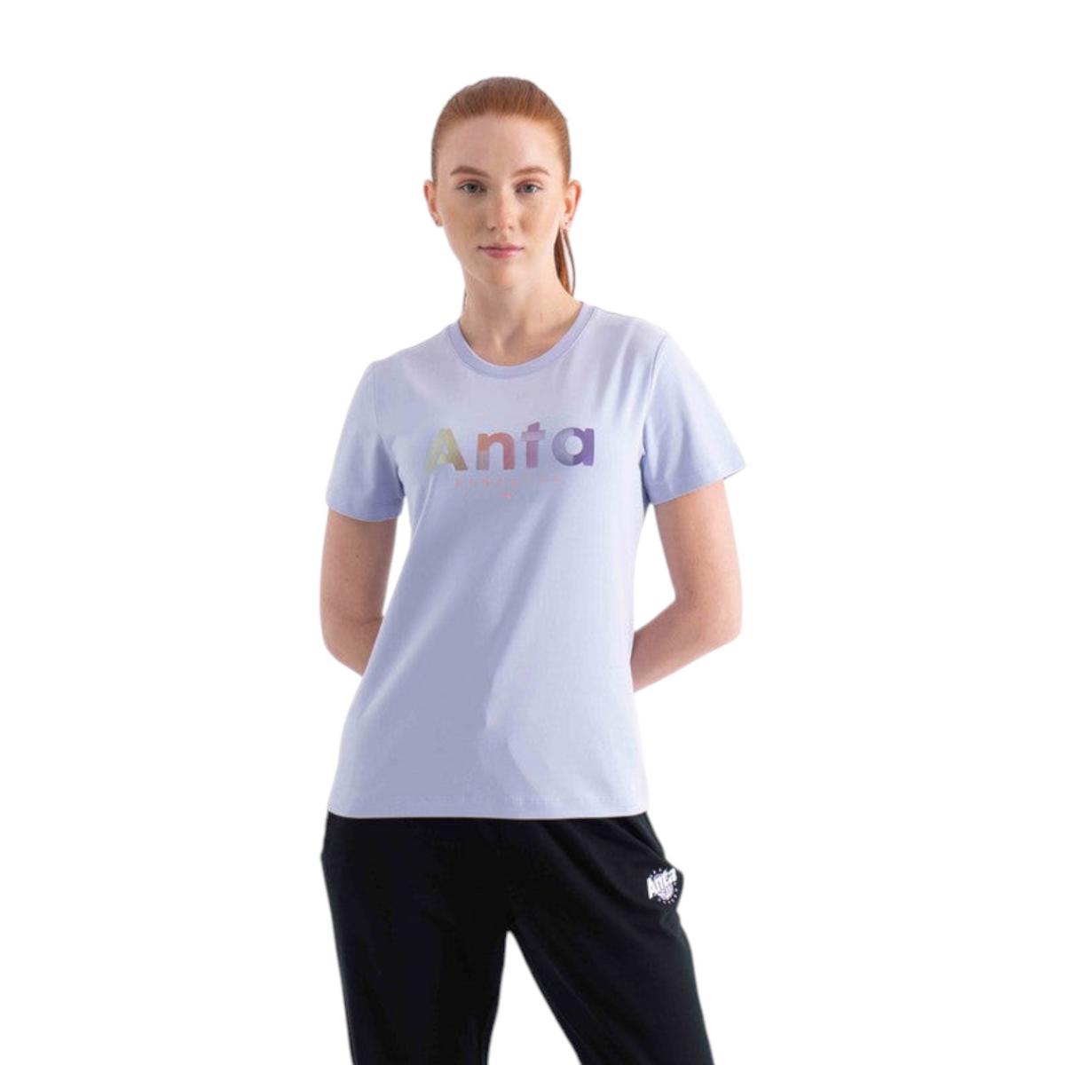 FRG woman wearing a light purple short-sleeve crew neck t-shirt with a multicoloured Anta logo graphic on the chest