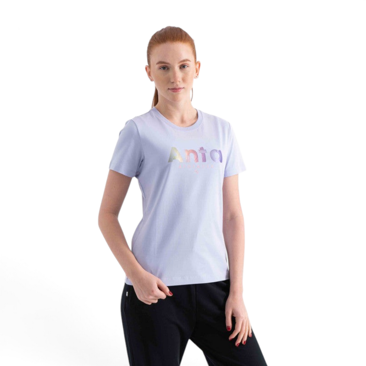 FRG SS TEE in light purple with a metallic rainbow logo print worn by a woman against a white background