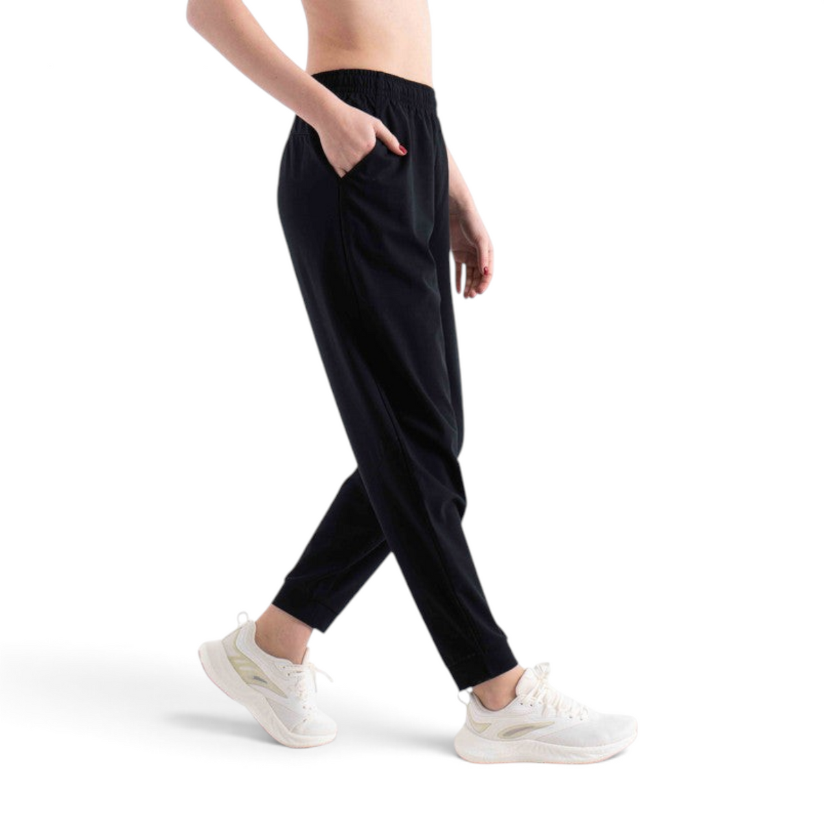 FRG black knit ankle pants with an elastic waistband and side pockets worn by a model with white athletic sneakers