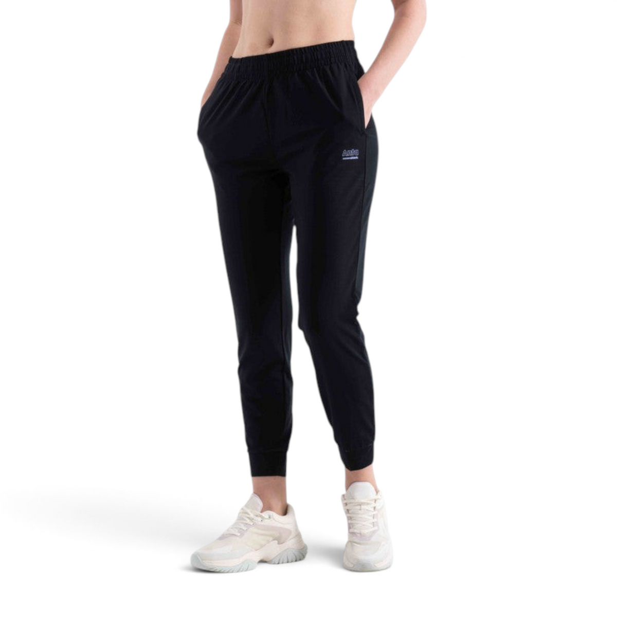 FRG black knit ankle pants with an elastic waistband and side pockets worn with white sneakers