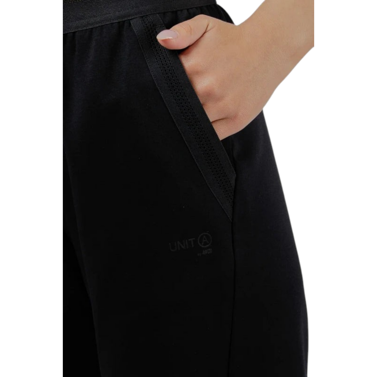 FRG ANTA black knit track pants featuring a textured pocket trim and subtle branding on the hip