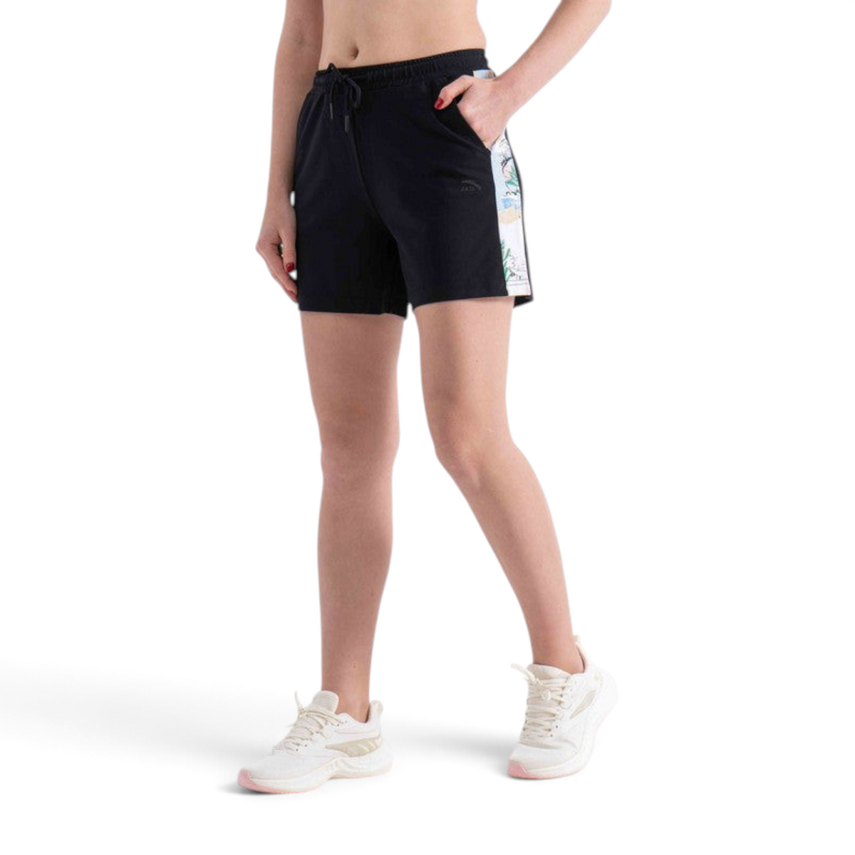 FRG black knit shorts featuring a white side panel with a graphic print, worn by a model with white sneakers.