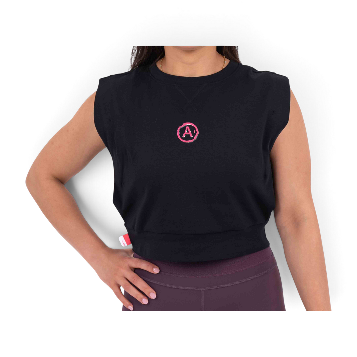 FRG black sleeveless cropped t-shirt with a pink circular logo on the chest and a small side label