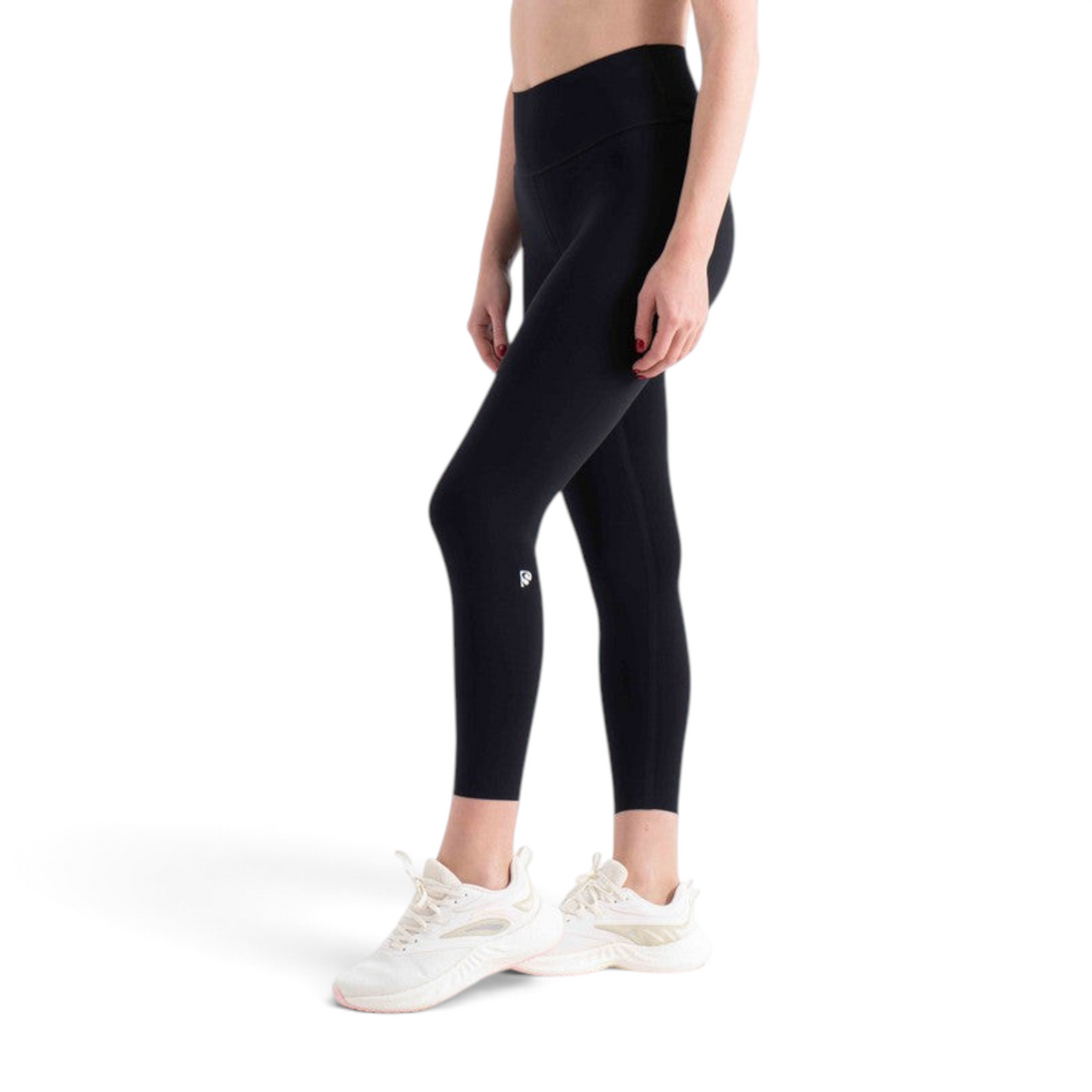 FRG tight ankle pants in black worn by a model with white athletic sneakers against a plain white background