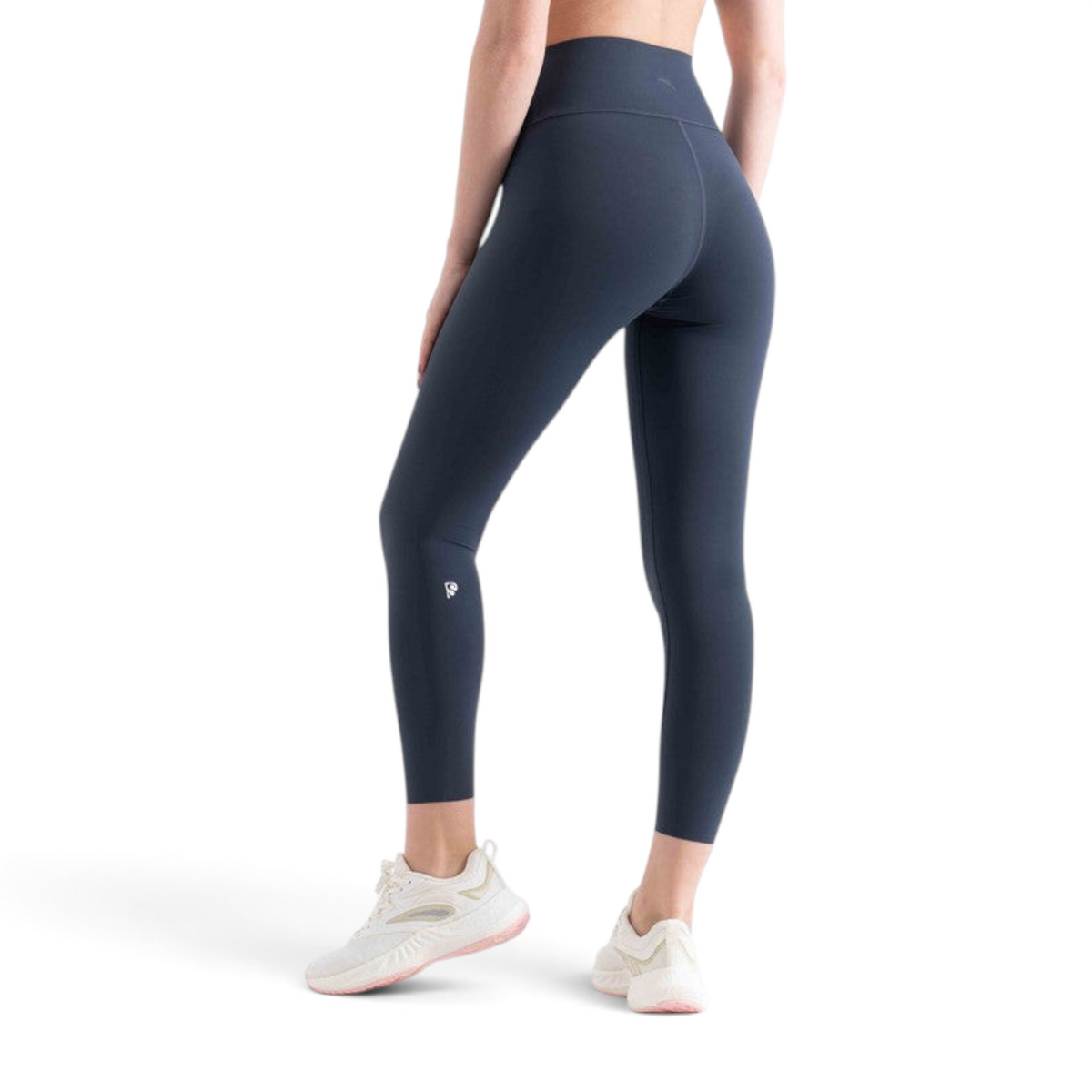 FRG tight ankle pants in dark grey, featuring a high-waisted fit and small logo detail, worn by a model.