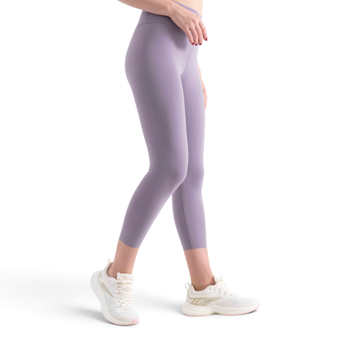 FRG tight ankle pants in light purple, featuring a high-waisted fit and cropped length worn with white sneakers.