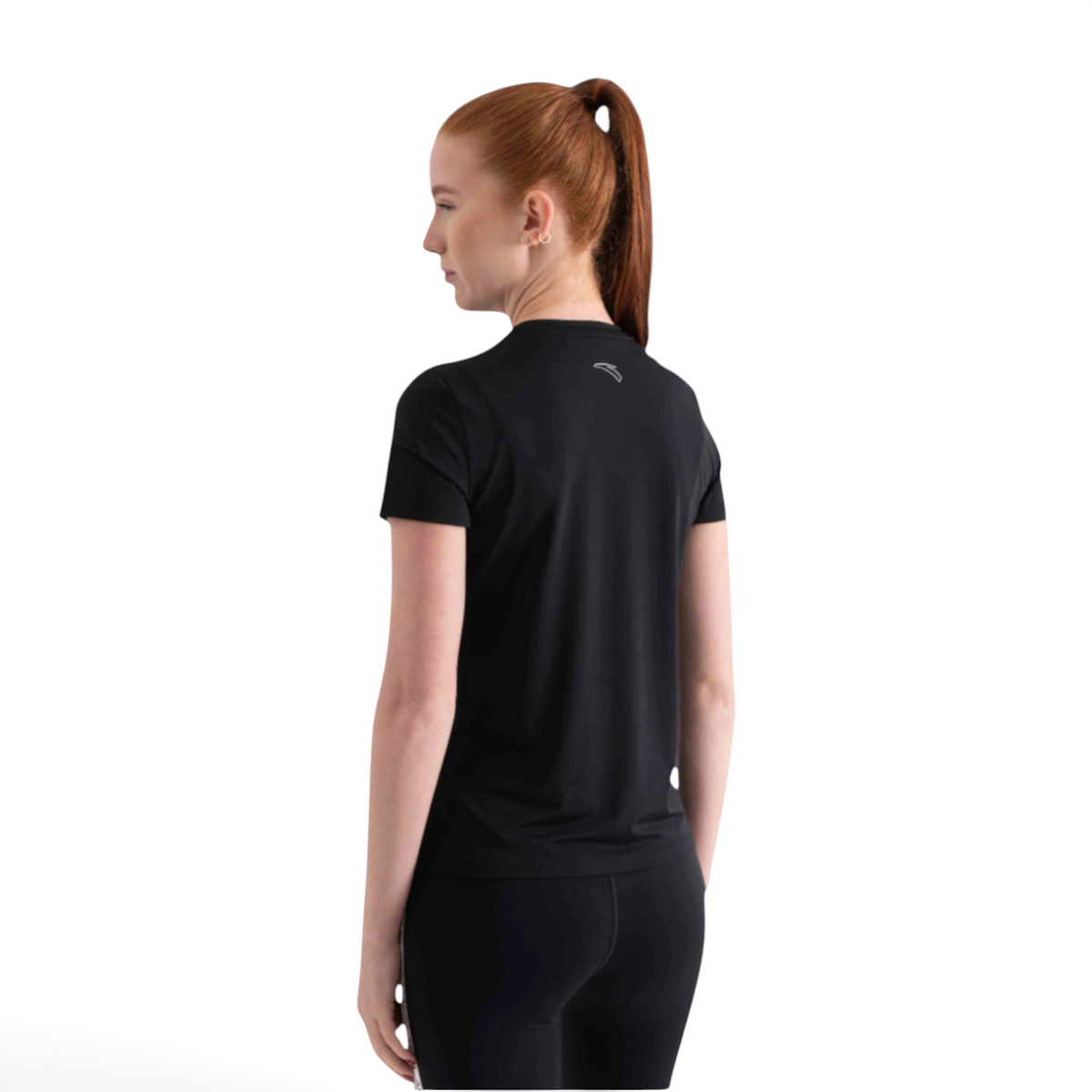 A woman wearing a black FRG short sleeve athletic t-shirt with a small logo on the back, viewed from behind.
