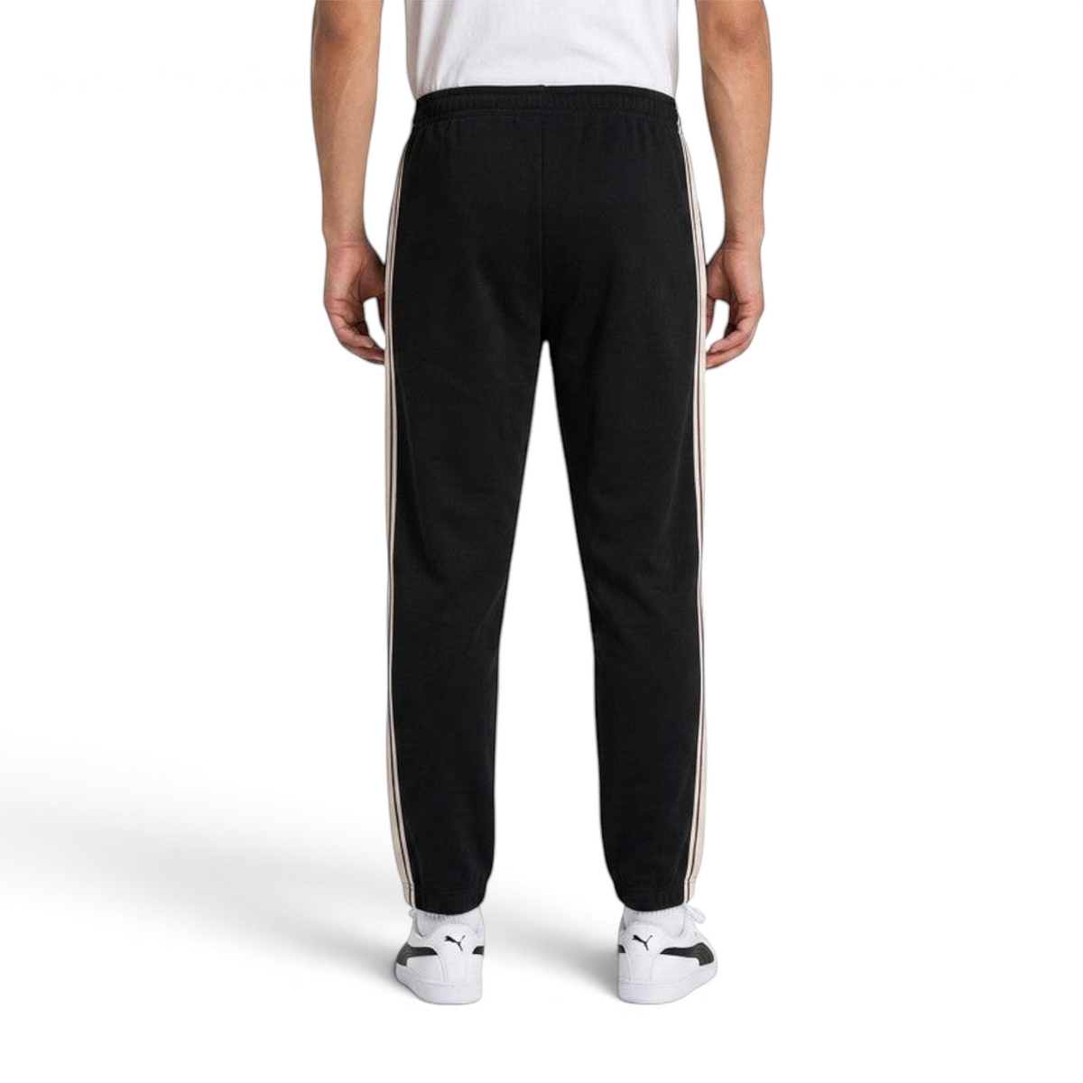 FRG black knit track pants for men with tapered fit and side stripe detail, viewed from the back.