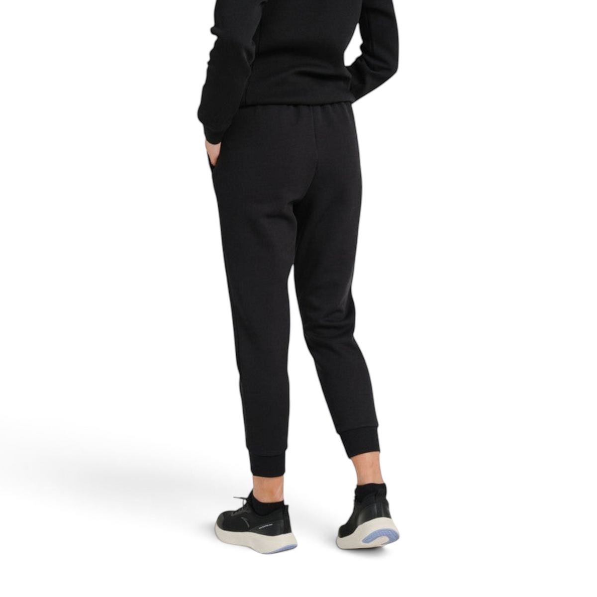 FRG ANTA A-Sports Shape black knit ankle pants worn by a model, showing a back view of the tapered athletic fit.