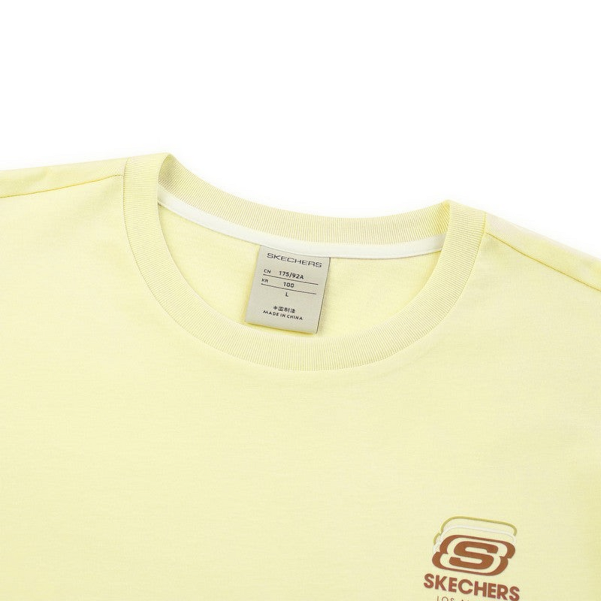 FRG Skechers light yellow crew neck t-shirt with a small logo graphic on the chest