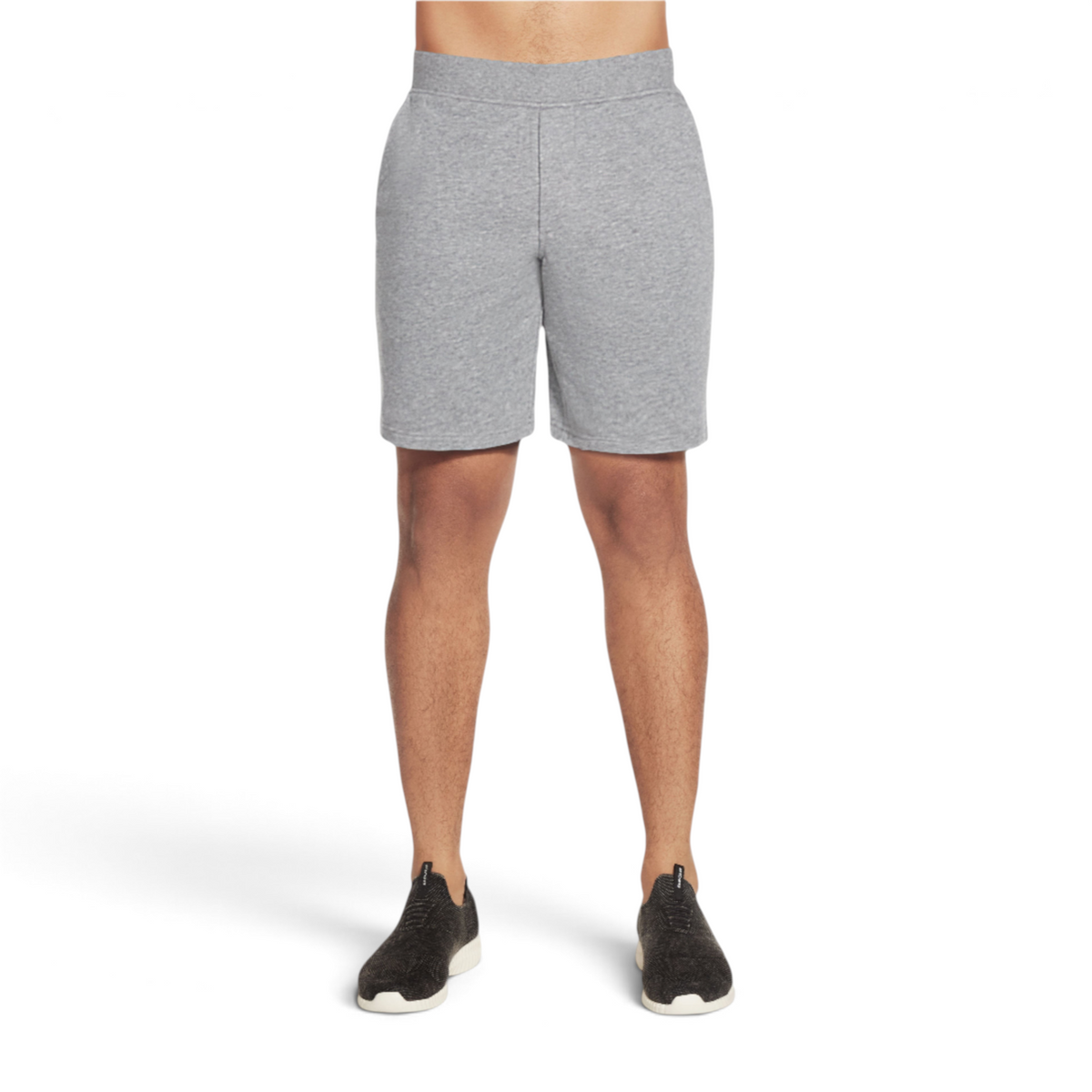 FRG men's grey knit shorts with an elastic waistband worn by a model with black athletic sneakers