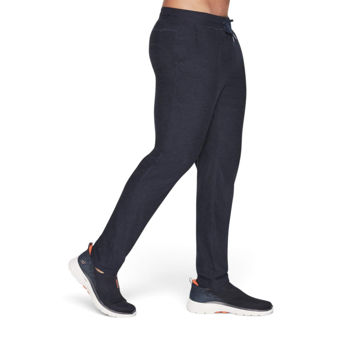 FRG SKECHKNITS ULTRA GO LITE tapered navy blue athletic pants worn by a model with matching sneakers