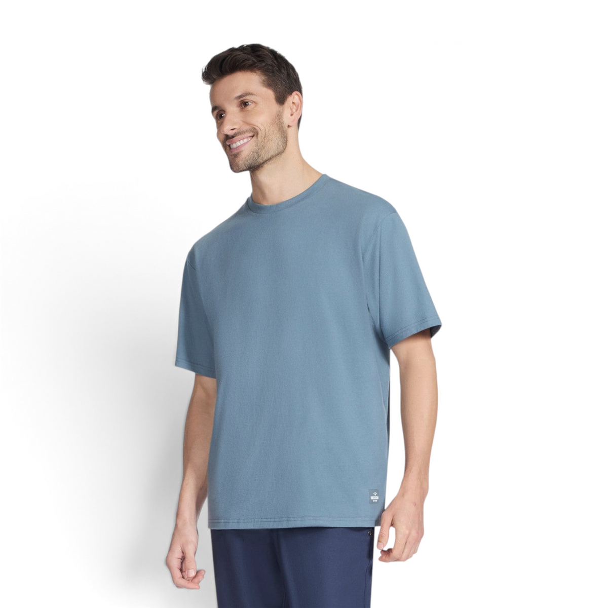 A man wearing a blue FRG SKECH-JERSEY MAX short sleeve crew neck t-shirt against a plain white background.