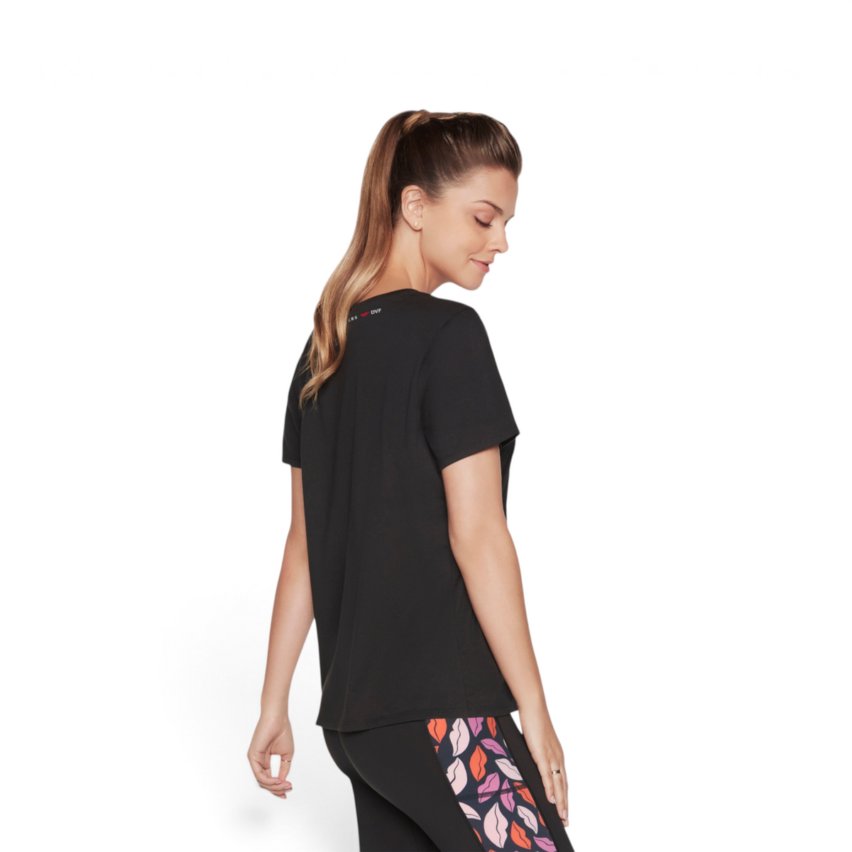FRG DVF Godri tee in black, made from a polyester spandex blend, worn by a model from a side view.